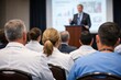 © Olga Ко - Medical conference audience: Group of doctors listening to a lecture at a professional development seminar.