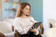 © JackF - In study room, girl visitor listens to lecture, makes notes on tablet, conducts self-monitoring and questionnaires after lecture and fills out online form, fills out questionnaire.