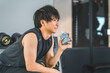 © buritora - Young Asian man drinking jelly drink to refuel after training at the gym