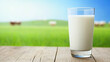 © Atchariya63 - Fresh milk glass rustic wooden table green field sunlight peaceful morning refreshment