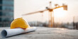 © Artificial South - Construction site with a safety helmet on blueprint papers