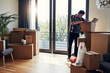 © BuyoutReese09/peopleimages.com - Real estate, man and unpacking boxes in new home for moving in, property purchase or investment. Homeowner, mature person or unboxing cardboard package for relocation, organizing house or fresh start