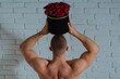 © Volodymyr - Flowers romance idea. Flowers masculine gift concept. Flowers love symbol. Sexy man hold roses bouquet. Romantic, valentine, dating concept. Muscular man with roses gift.