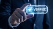 © Depot - Businessman verifying identity with glowing verified badge