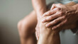 © Nova Zigres - Close-up of hands pressing tight calf muscle, concept of dehydration-related cramps and muscle pain