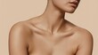 © Tatiana - Flawless smooth tanned skin of a young woman's neck, elegant collarbones, bare shoulders, and delicate chin shown in a close up studio view highlighting natural beauty and body care