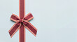 © Vera - Ribbon bow on a gift box with a light blue background