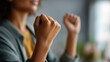 © Kateryna - Raised fists showing solidarity and empowerment gesture hands demonstrating strength for movement shown celebration of rights with symbolic pose visible neutral background with