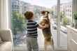 © artsterdam - Little boy with pet dog by a large window