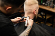 © Mariya Surmacheva - Barber Working on Head with Electric Clippers – Close-Up