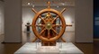 © photoplotnikov - Vintage wooden ship wheel displayed in maritime museum exhibition hall with brass hub detailing and polished wood finish