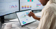 © Andrey Popov - Market Researcher Analyzing Financial Trends