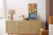 © Pixel-Shot - Books, record player and lamp on chest of drawers near window in living room, closeup