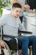 © auremar - young man in a wheelchair at home
