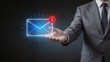 © Lila - Businessman holding glowing email icon