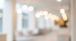 © salwa - Abstract blurred background of a modern bright office interior with bokeh lights.