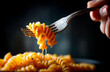 © aboutnuylove - Fork with pasta on a black background. Selective focus.
