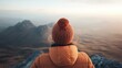 © Larisa AI - A lone individual admires breathtaking mountain scenery at sunrise, portraying the profound connection between humans and nature while inspiring personal reflection and adventure.