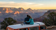 © Sonya - Couple enjoying scenic canyon sunset on road trip
