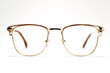 © halcon1 - Stylish eyeglasses with a gold metal frame and clear lenses displayed against a plain white background, emphasizing modern eyewear design and fashion
