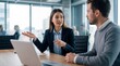© ryker - Young professional woman explaining project details to male colleague in modern office, confident discussion and collaborative mood
