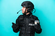 © luismolinero - SWAT caucasian man isolated on blue background holding coffee to take away and a mobile