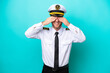 © luismolinero - Airplane caucasian pilot isolated on blue background covering eyes by hands