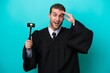 © luismolinero - Judge caucasian man isolated on blue background with surprise expression