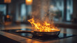 © Jean - Préparation des aliments dans une cuisine moderne avec une poêle en feu