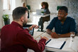 © djile - Business meeting with contract signing in modern office