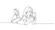 © krisnanto - A delightful continuous line drawing illustrates a young child enjoying a mobile device while lying down