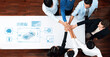 © InfiniteFlow - Diverse group of professionals collaborating over automotive data analysis. They engage in teamwork, innovation, and strategic planning, driving future transportation solutions. Trope
