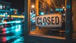 © ghulab - Closed sign on glass window with city lights reflection at night
