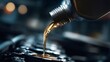 © Oleh - Golden motor oil pouring from a bottle into a car engine, close up stream showing clean lubricant during maintenance and oil change for vehicle protection and performance