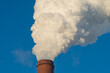 © Dmitry Presnyakov - Smoking chimney releasing smoke against a blue sky. Smoke from factory pipe of heat station in the city. Air pollution. Nuclear power plant cooling. CO2, greenhouse gases emissions. CHP emissions.