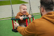 © phpetrunina14 - Father and Baby Enjoying Swing Time.