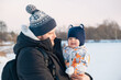 © phpetrunina14 - Father and Baby in Winter Landscape Copy Space