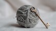 © Picwagon Agency - A tangled ball of grey twine with a vintage key