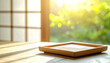 © Jarumas - An empty wooden tray in morning sunlight creates a calm zen atmosphere.
