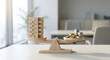 © solom - wooden apartment building model balanced with stacks of gold and silver coins on a scale for real estate investment property value mortgage and financial planning concept