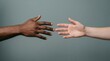 © Robotoyo - Two Diverse Hands Reaching Toward Each Other in Studio, Unity and Connection Concept