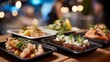 © forenna - Sophisticated compostable trays exhibiting a selection of gourmet appetizers during a corporate event promoting green initiatives. Sleek venue setting with stylish decor, ambient lighting, and