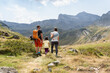© Esther Pueyo - Rear view of a family with two children hiking in the Valley of Neste de Badet, French Pyrenees.