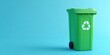 © IKM - The recycling bin standing on a clean turquoise background with generous copy space