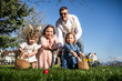 © ADDICTIVE STOCK - Family enjoying Easter egg hunt in the springtime