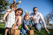 © ADDICTIVE STOCK - Family enjoying Easter egg hunt together