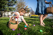 © ADDICTIVE STOCK - Child enjoying Easter egg hunt in springtime