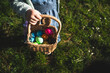 © ADDICTIVE STOCK - Girl holding basket of colorful Easter eggs