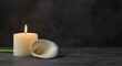 © TheWaterMeloonProjec - Classic sympathy card displaying a candle flame and white calla lily over a dark toned backdrop with copy space