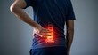 © Rahima - Man with glowing red spine indicating lower back pain and discomfort injury
